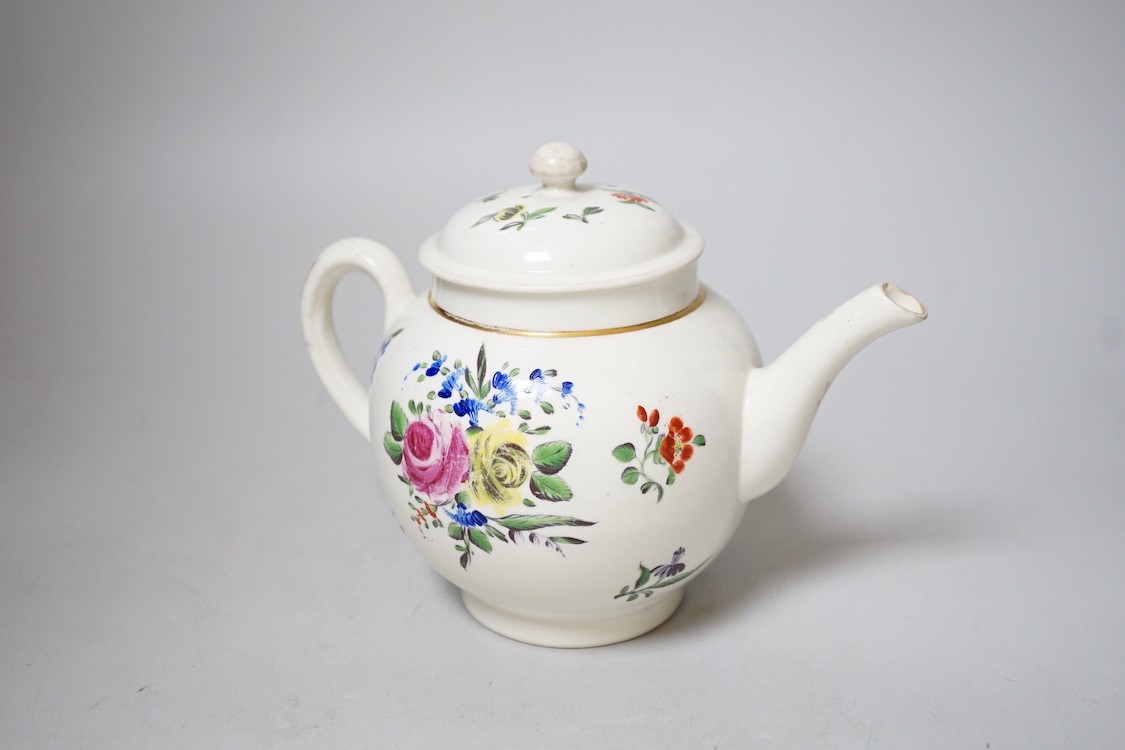 An 18th century Caughley teapot and cover with back to back roses, 15cms high including cover